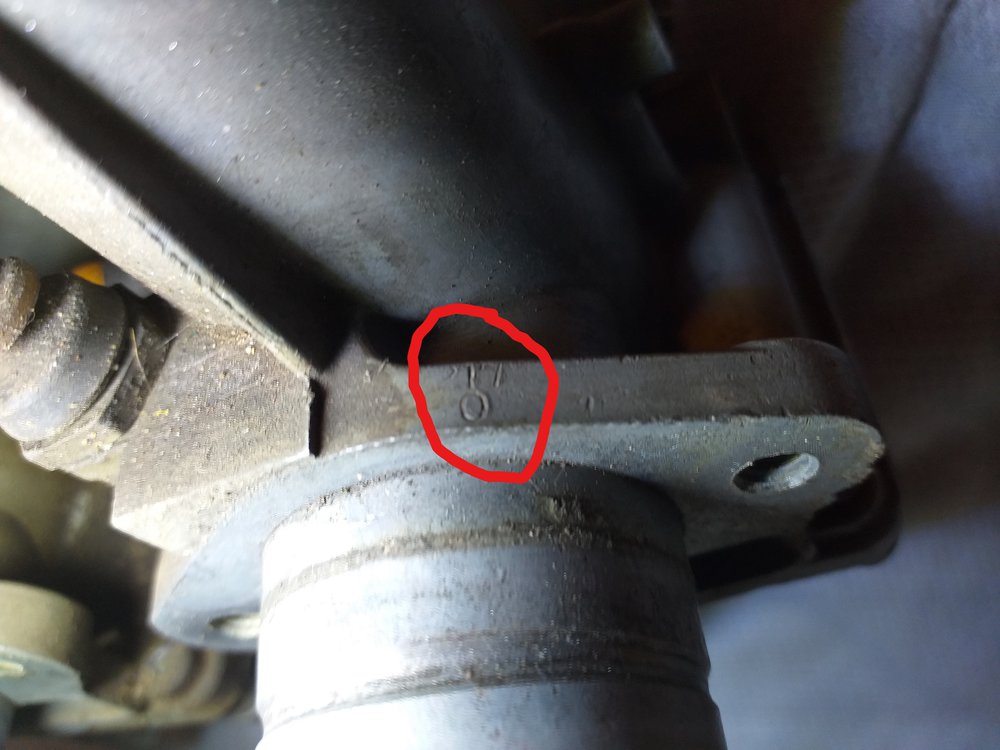 Carb ID number on engine flange.jpg